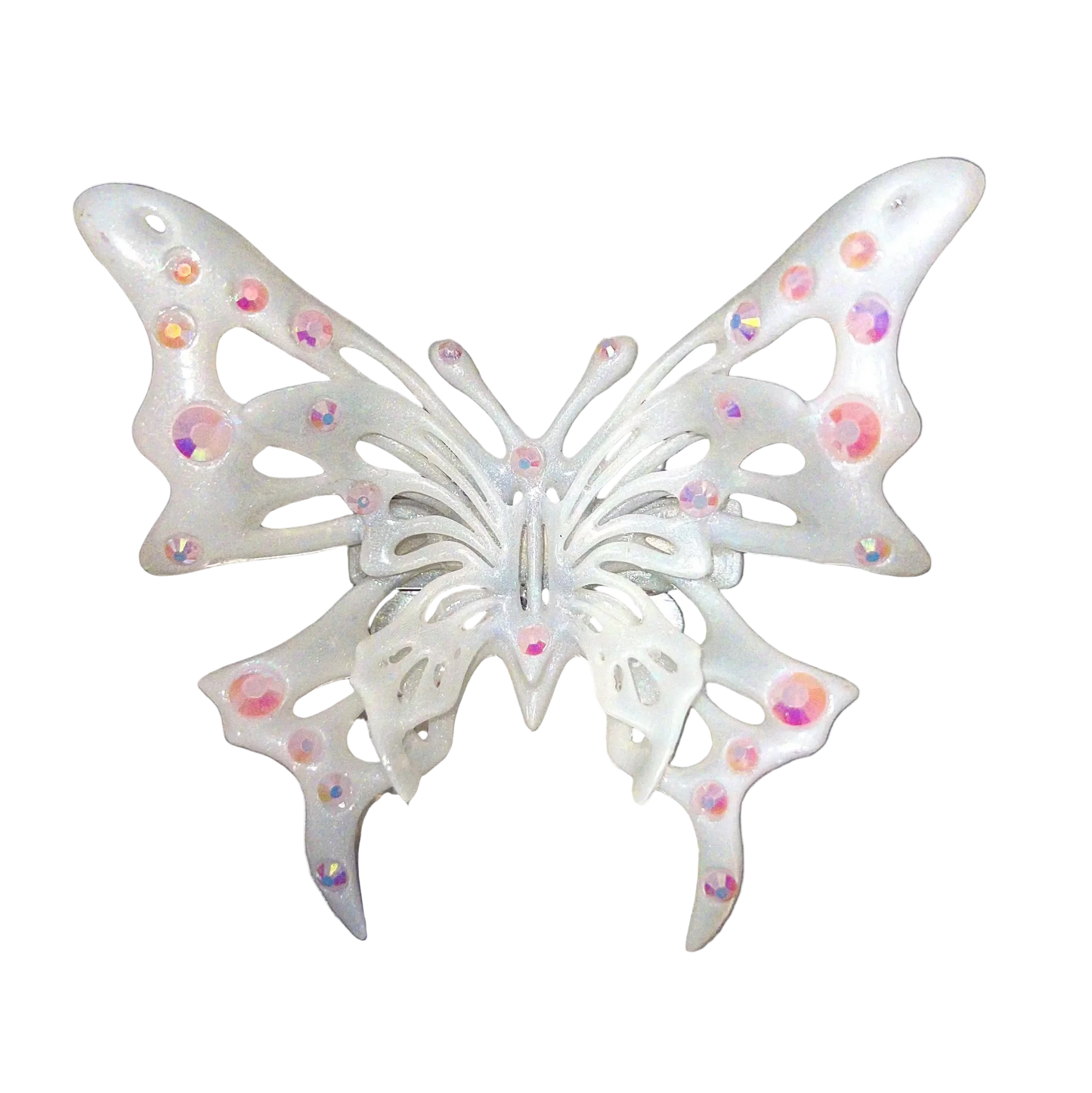 Decorative butterfly with rhinestones on a metallic surface