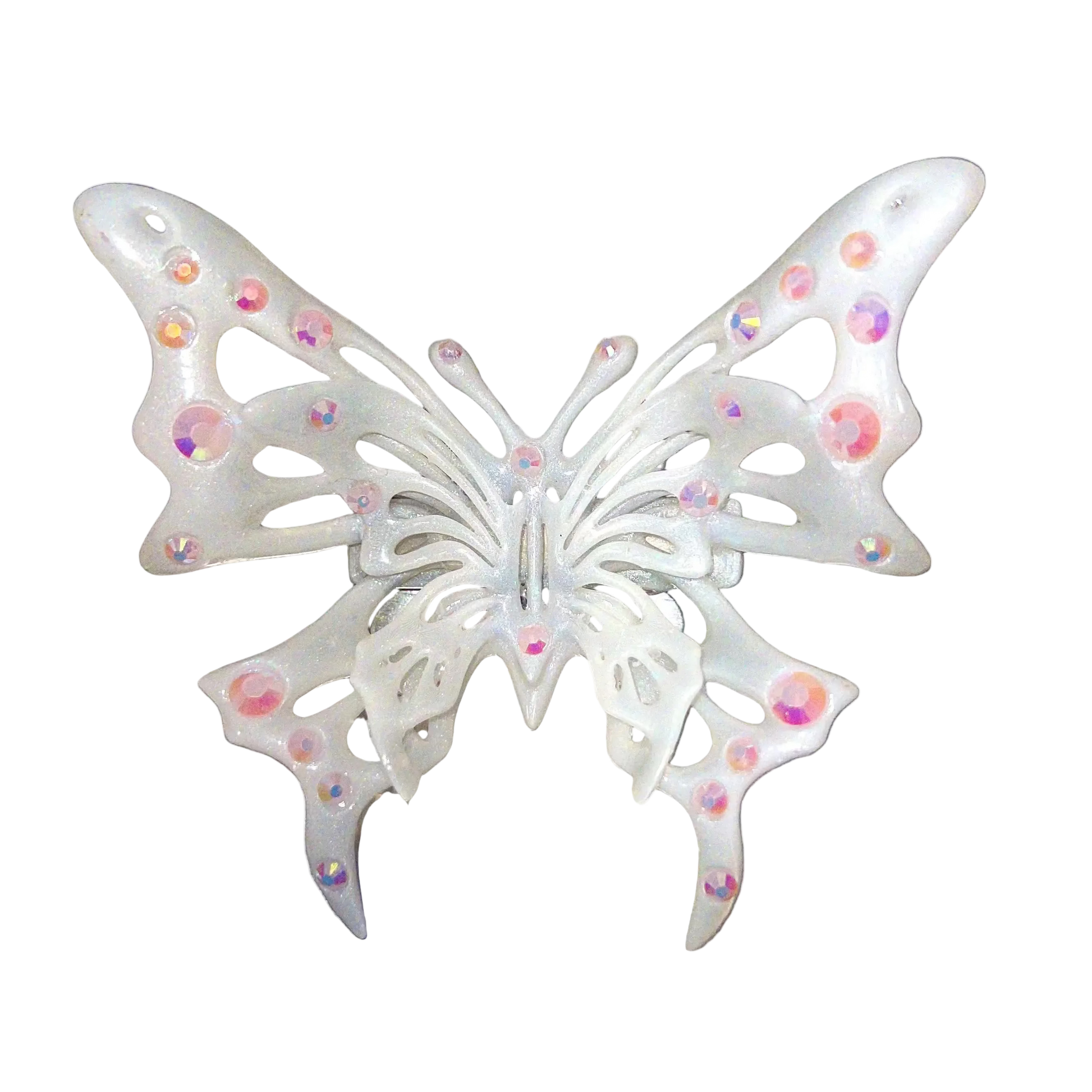 Decorative butterfly with rhinestones on a metallic surface